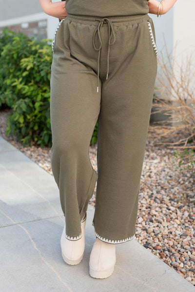 Front view of the olive embroidered pants