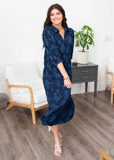 Front view of the small navy floral collared dress