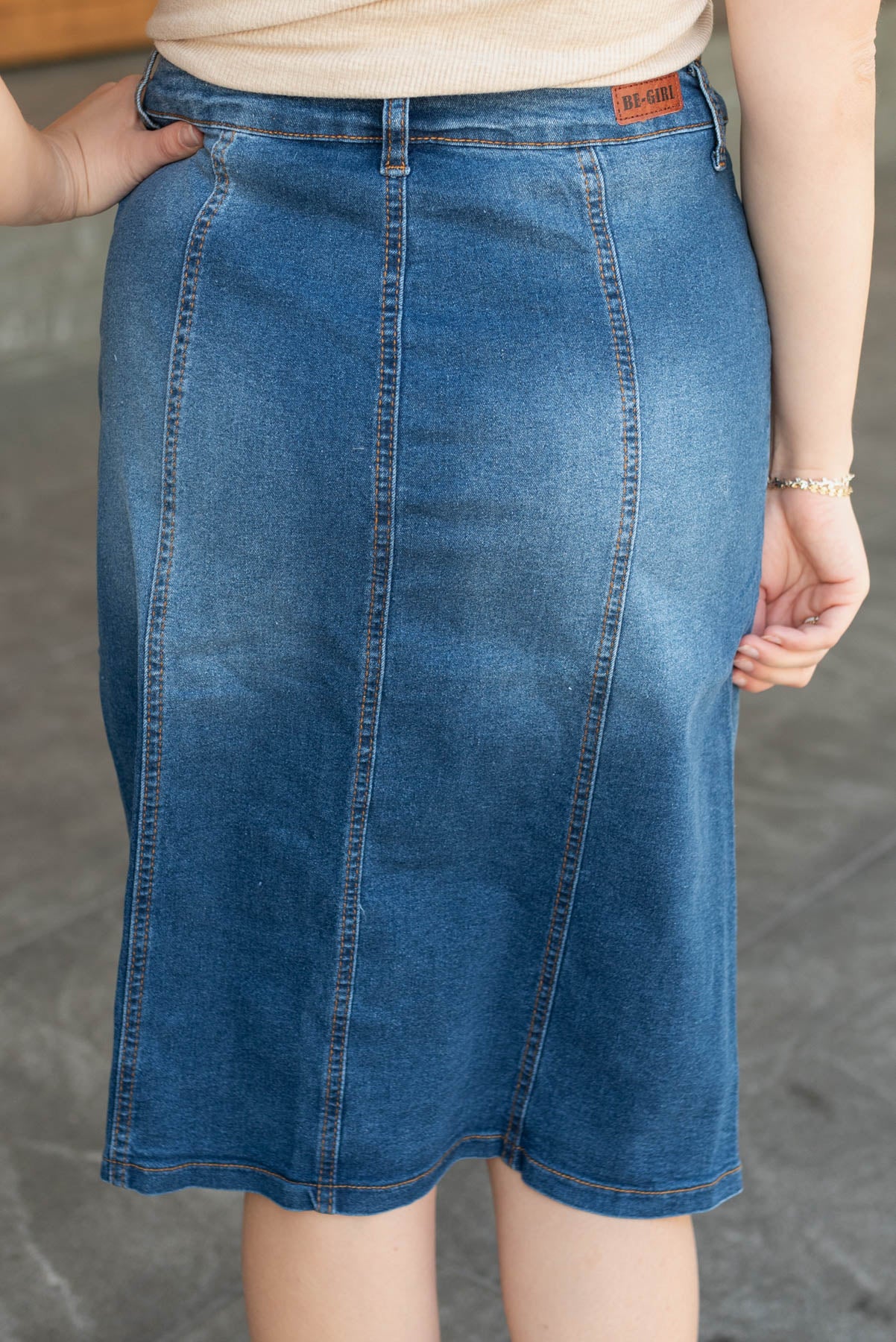 Back view of the indigo button skirt