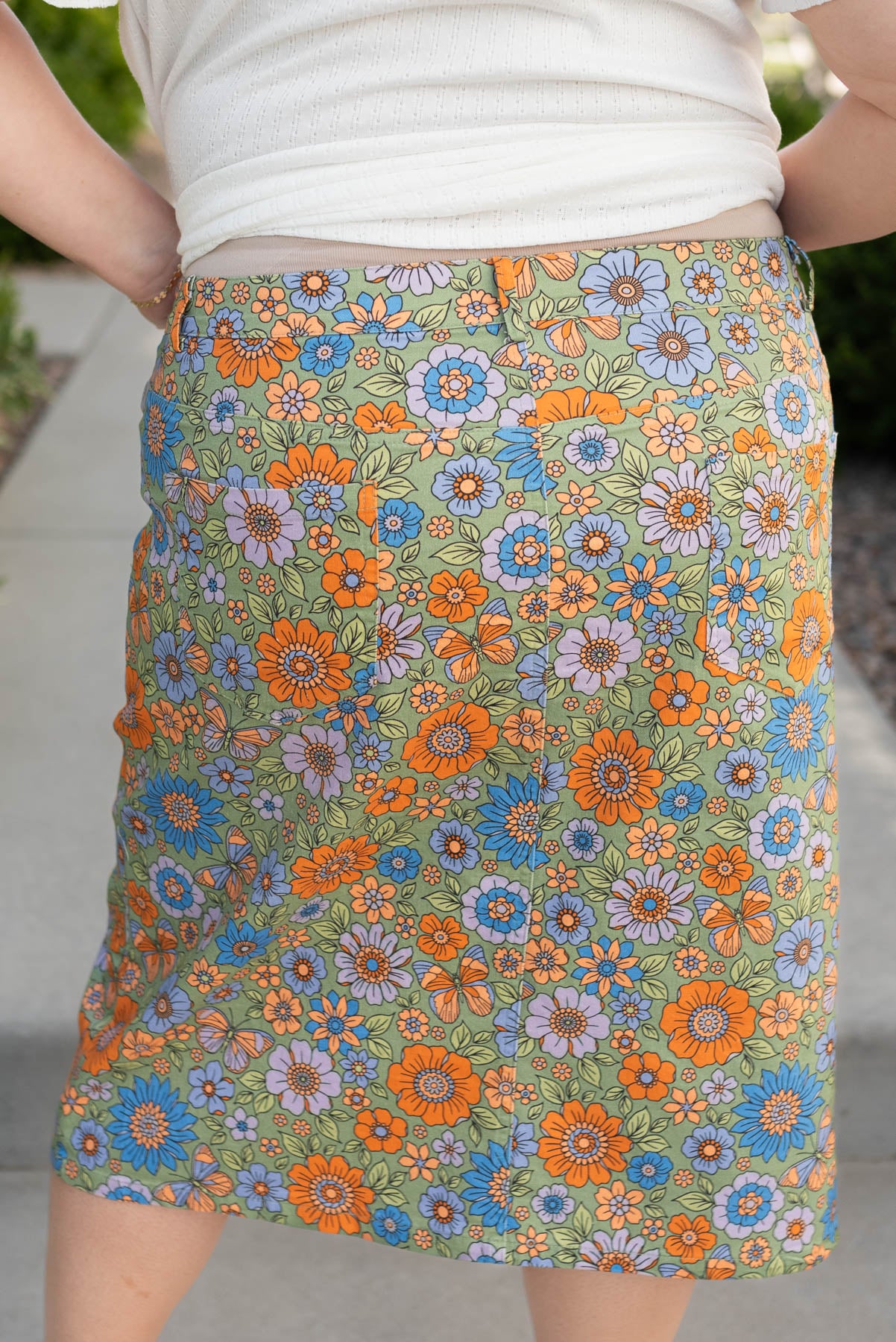 Back view of the plus size green multi floral jean skirt