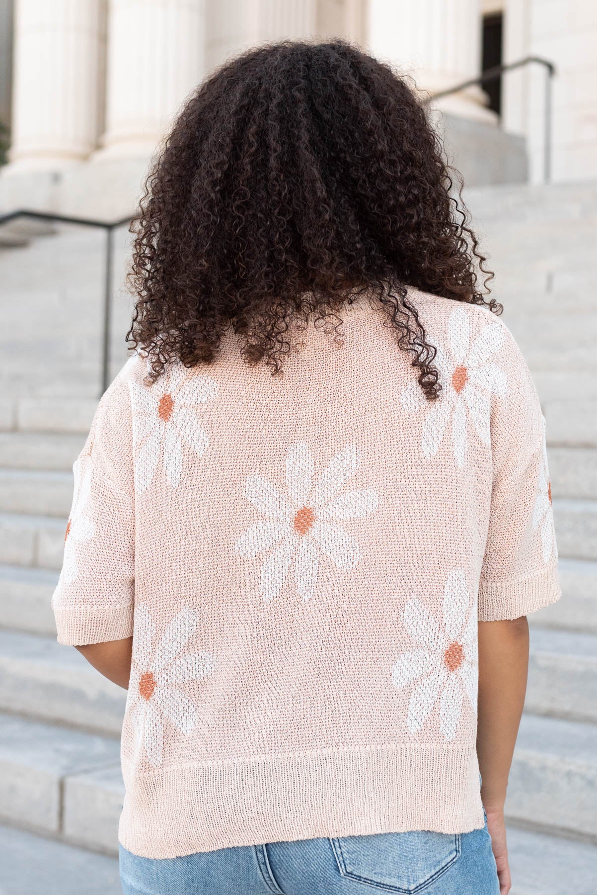 Back view of the taupe floral knit top