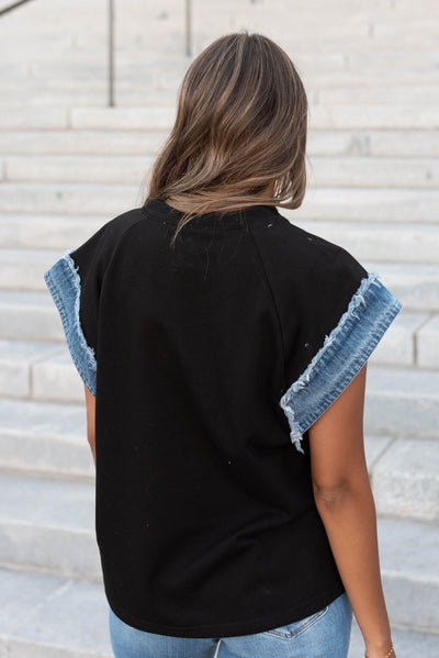 Back view of the black denim star top
