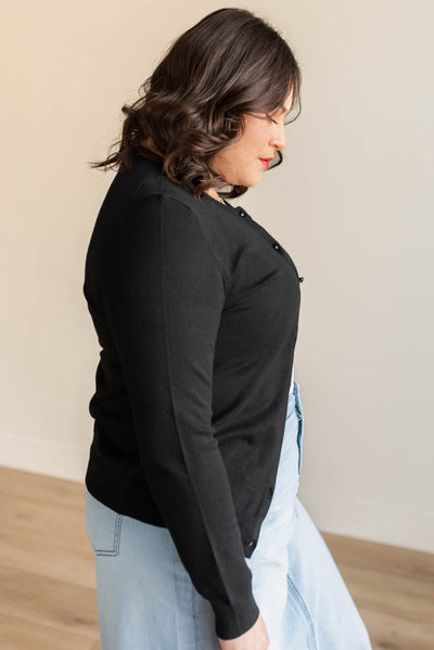 Side view of the plus size black buttondown cardigan