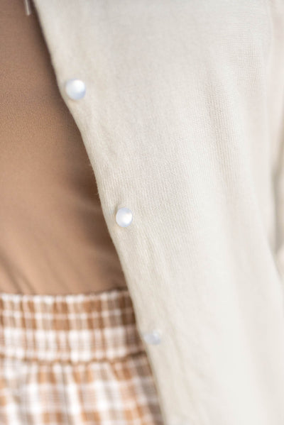 Close up of the buttons on the button down cardigan