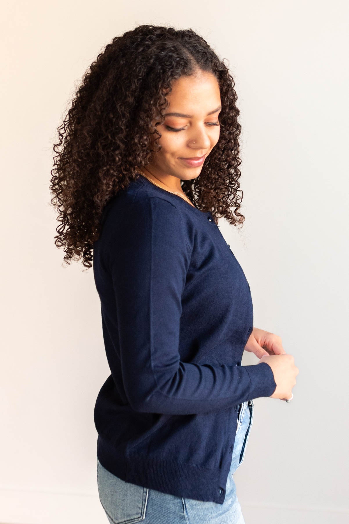 Side view of the navy button down cardigan