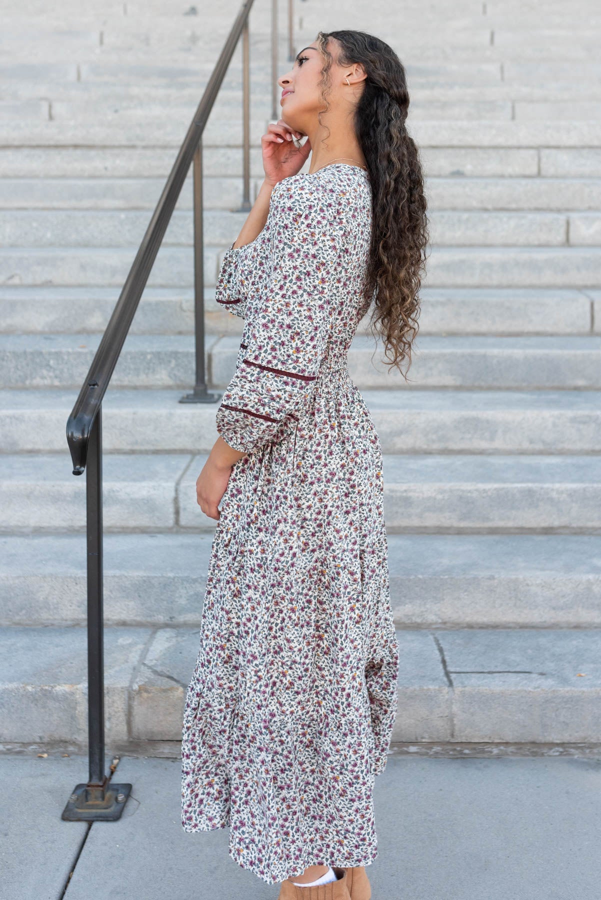 Side view of the burgundy floral dress