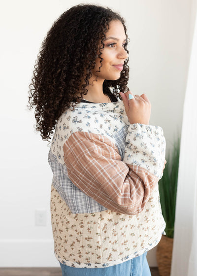 Side view of the quilted ivory patten block jacket