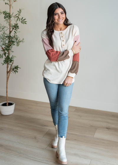 On the sleeve cream color block long sleeve top