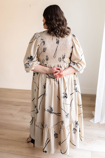 Back view of the plus size beige floral dress