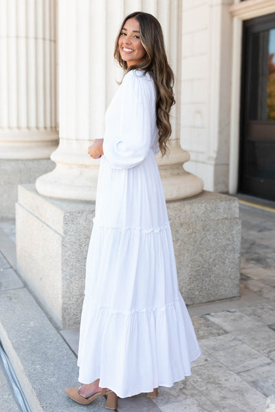 Side view of the white embroidered dress