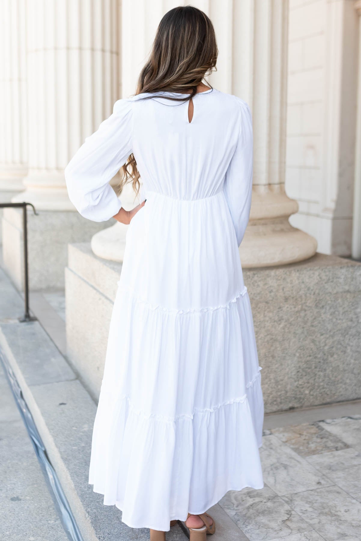 Back view of the white embroidered dress