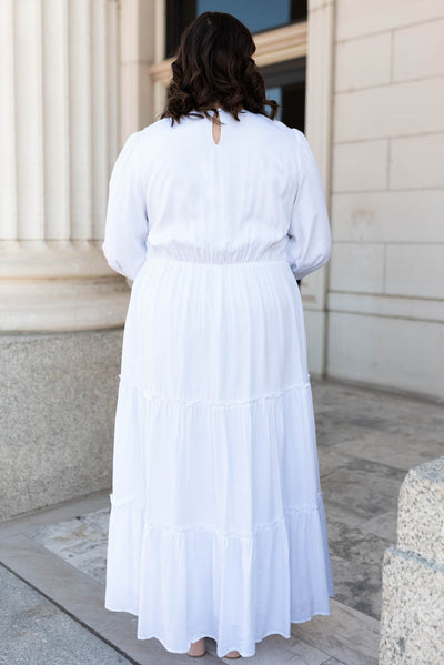 Back view of the plus size white embroidered dress