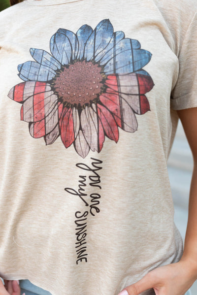 Close up of the words and flower on the America sunflower top