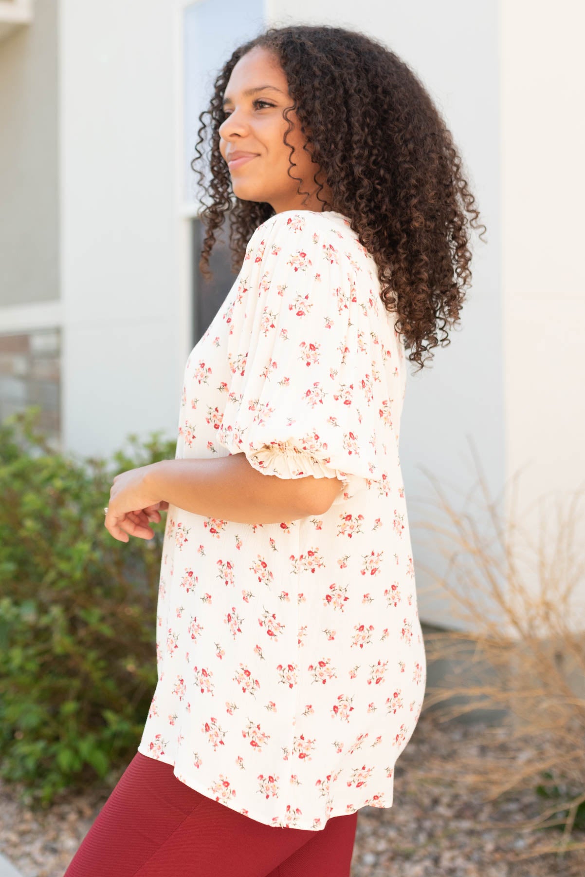 Side view of the cream floral top