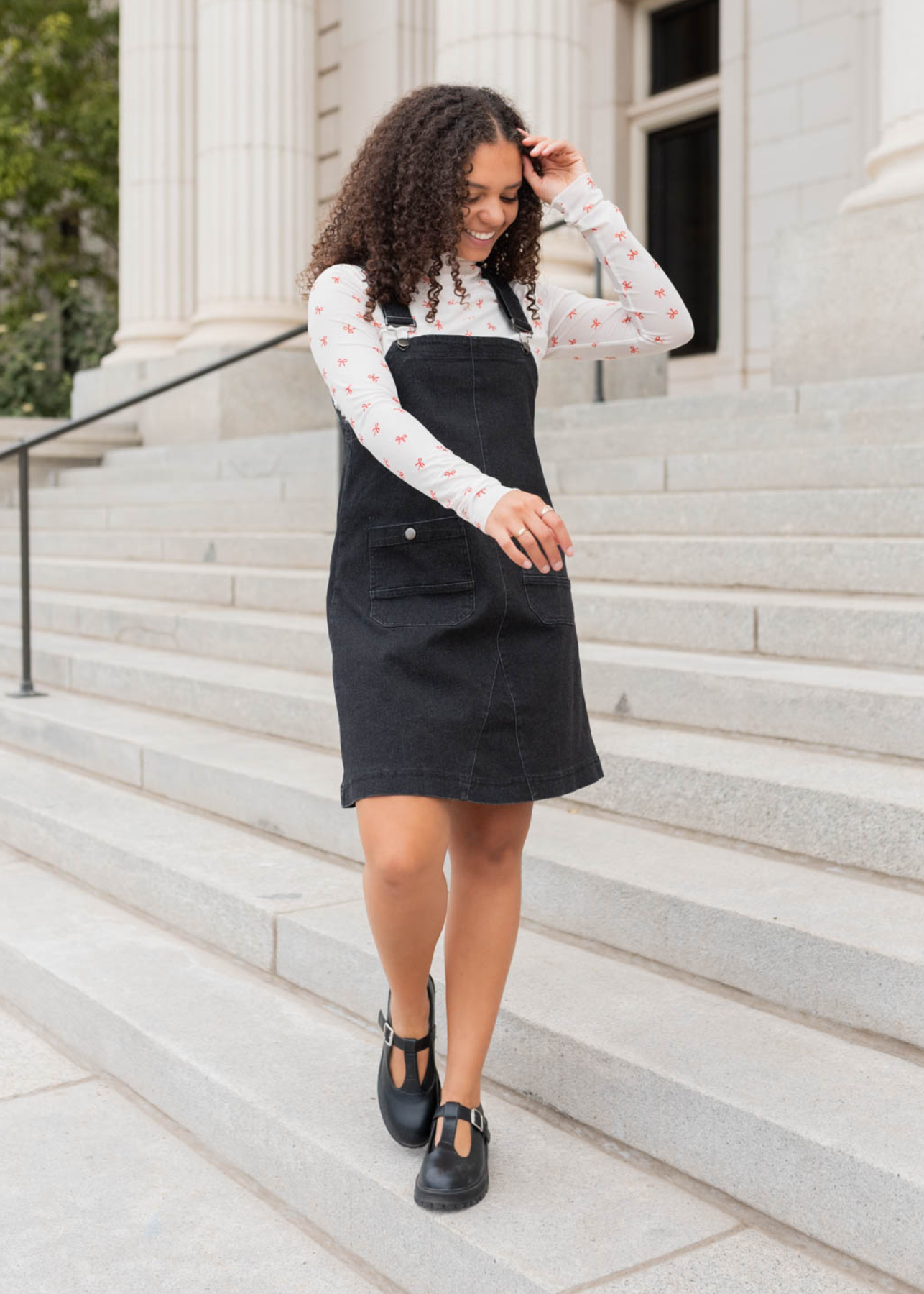 Black denim overall dress with above the knee length