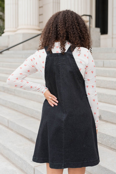 Back view of the black denim overall dress