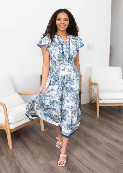 Blue pattern dress with blue stripe on the hem