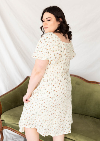 Side view of the cream floral print dress in plus size