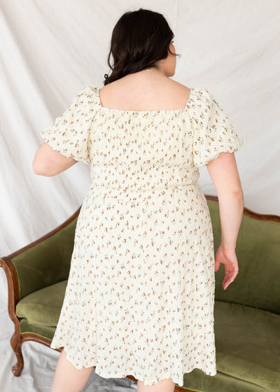 Back view of the plus size cream floral print dress