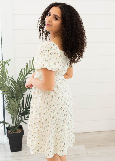 Side view of the cream floral printed dress