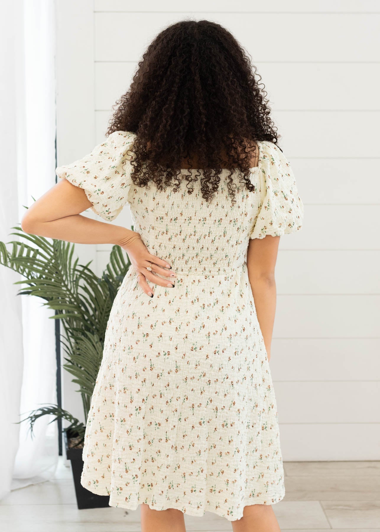 Back view of the cream floral printed dress