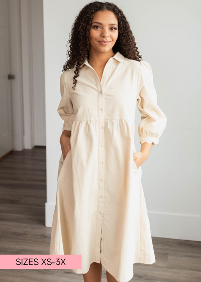 Beige button down dress with pockets and scalloped cuffs