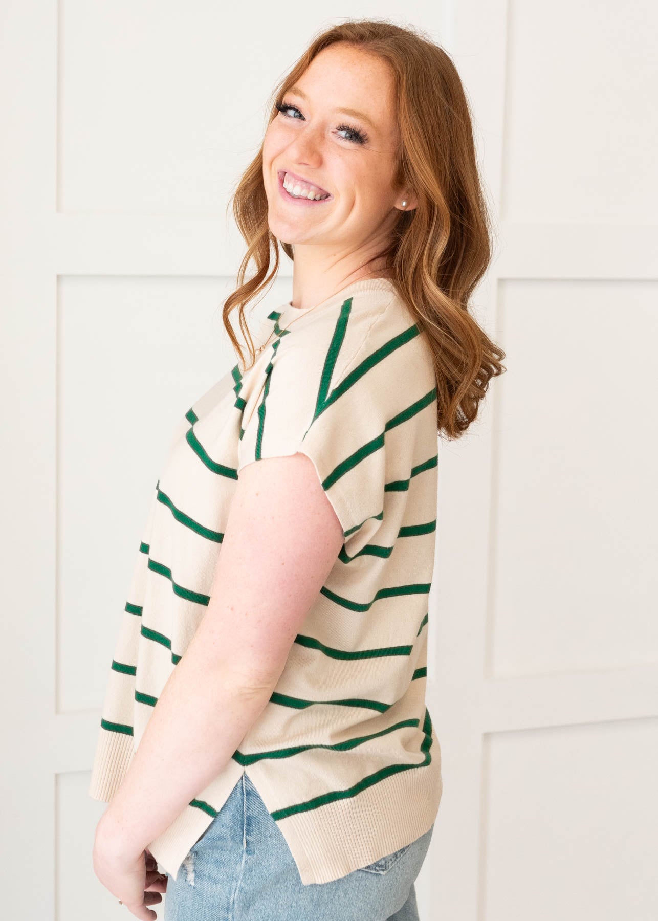 Side view of the green stripe sweater vest