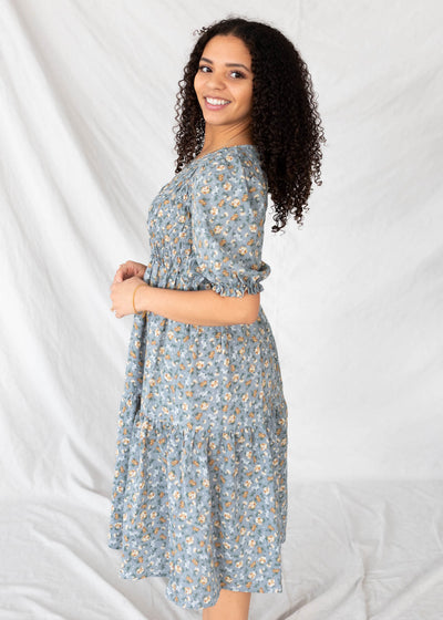 Side view of the dusty blue floral dress