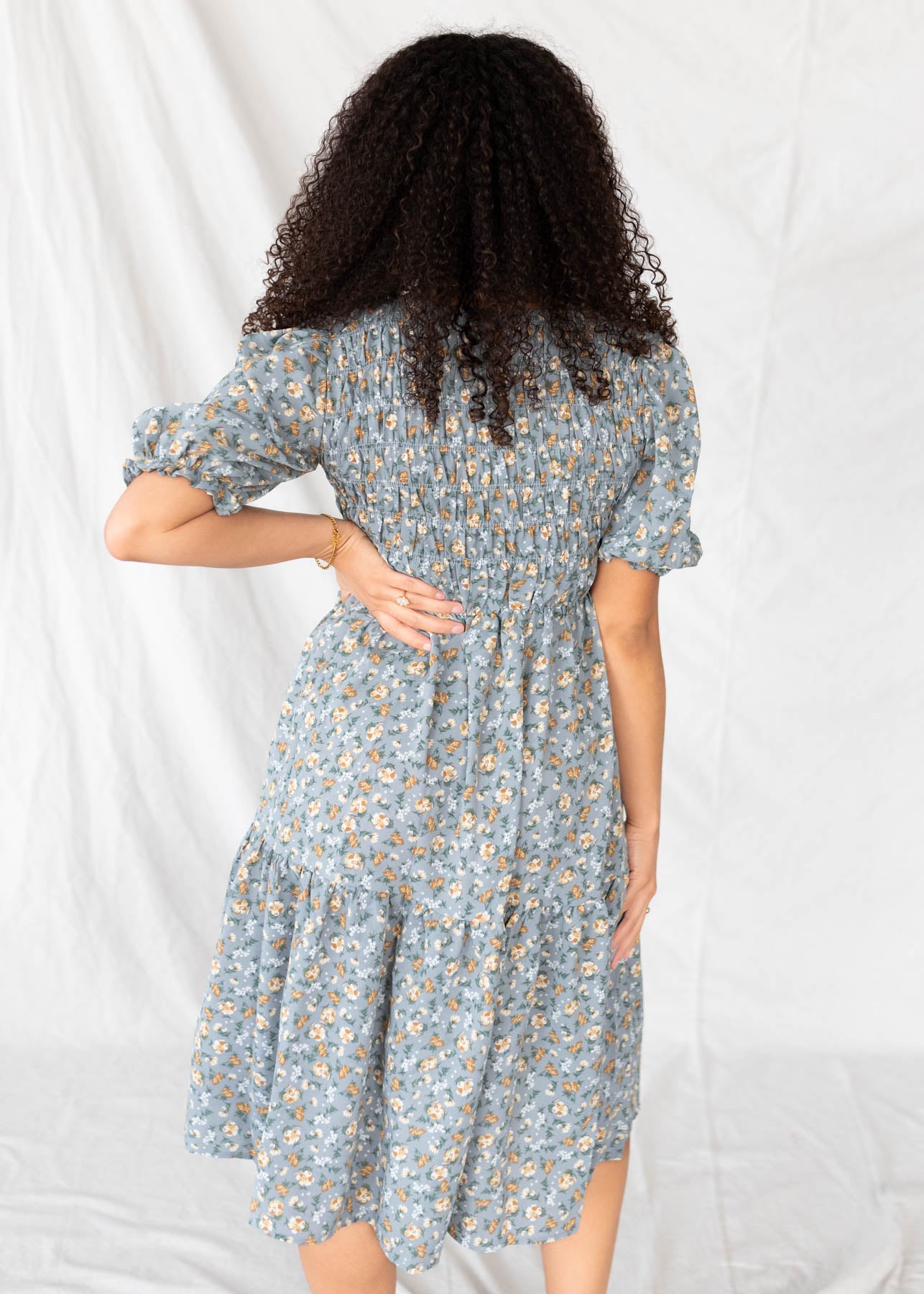 Back view of the dusty blue floral dress