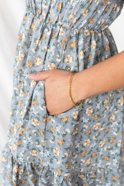 Close up of the fabric on the dusty blue floral dress