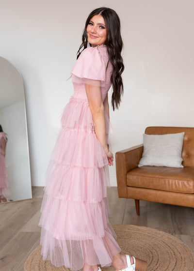 Side view of the vintage blush ruffle dress with flutter sleeves