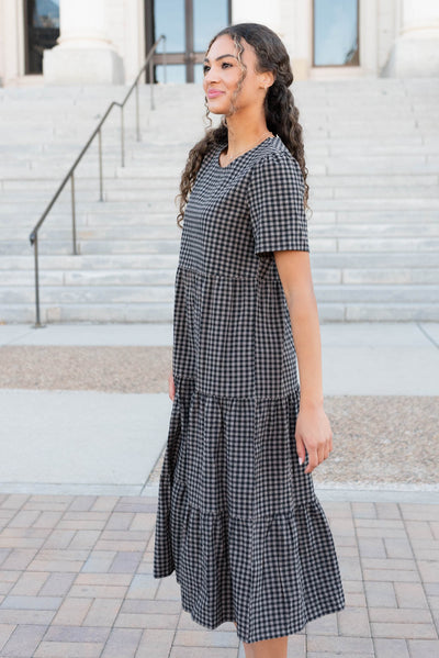 Side view of the charcoal gingham dress