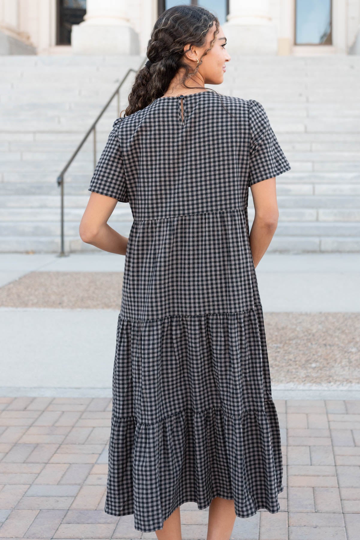 Back view of the charcoal gingham dress