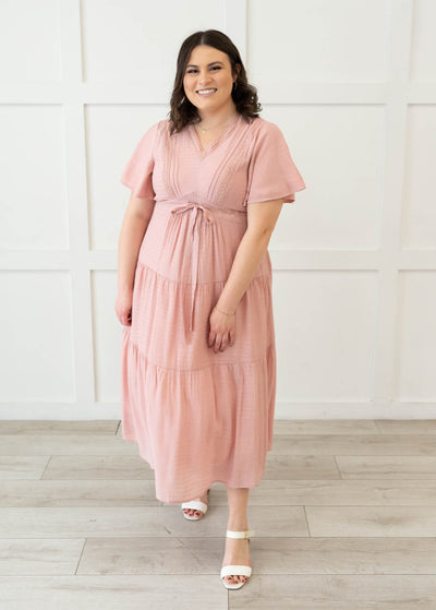 Blush textured tiered dress in plus size with a tie at the waist