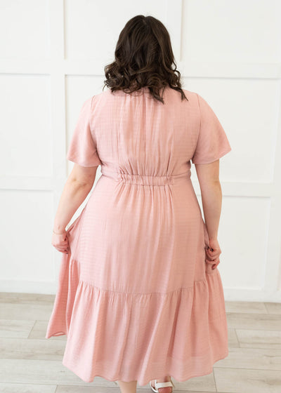 Back view of the the blush textured tiered dress in plus size