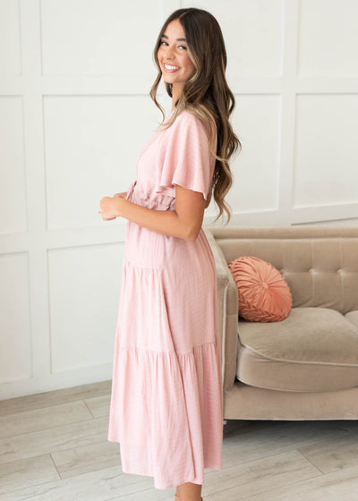 Side view of the blush textured tiered dress