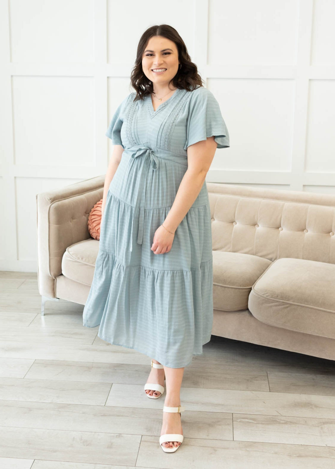 Plus size dusty blue textured tiered dress with a tie at the waist