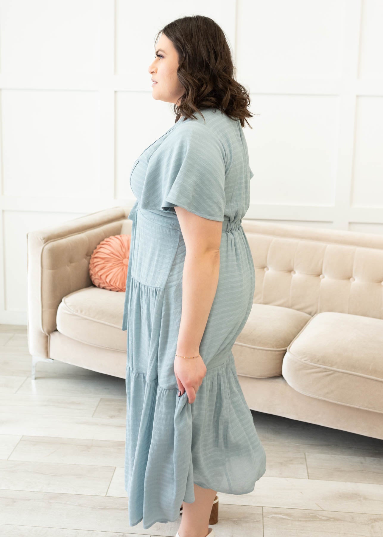 Side view of the dusty blue textured tiered dress in plus size