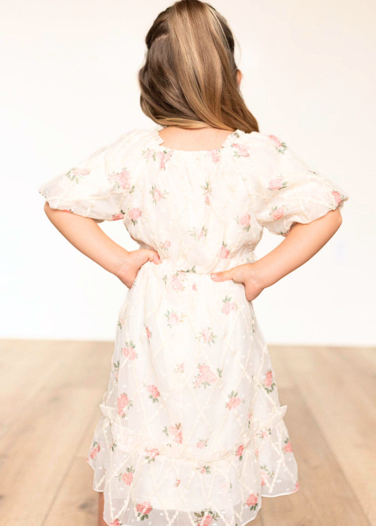 Back view of the cream rose little girls dress