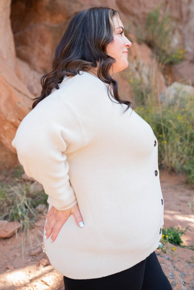 Side view of the sand beige button down cardigan in plus size