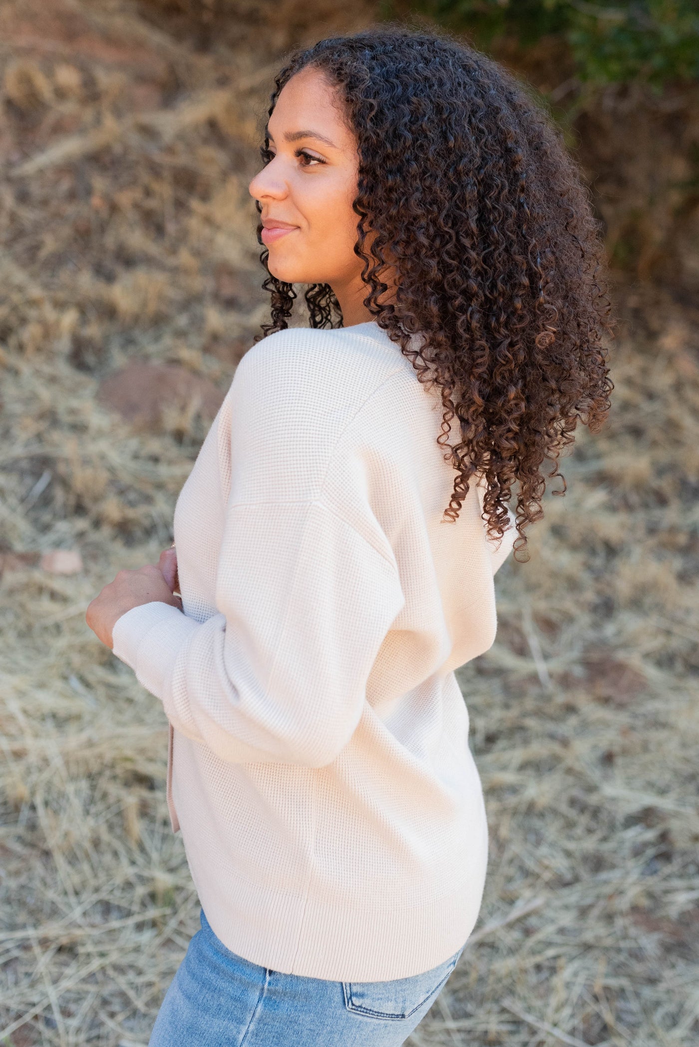 Side view of the sand beige buttondown cardigan