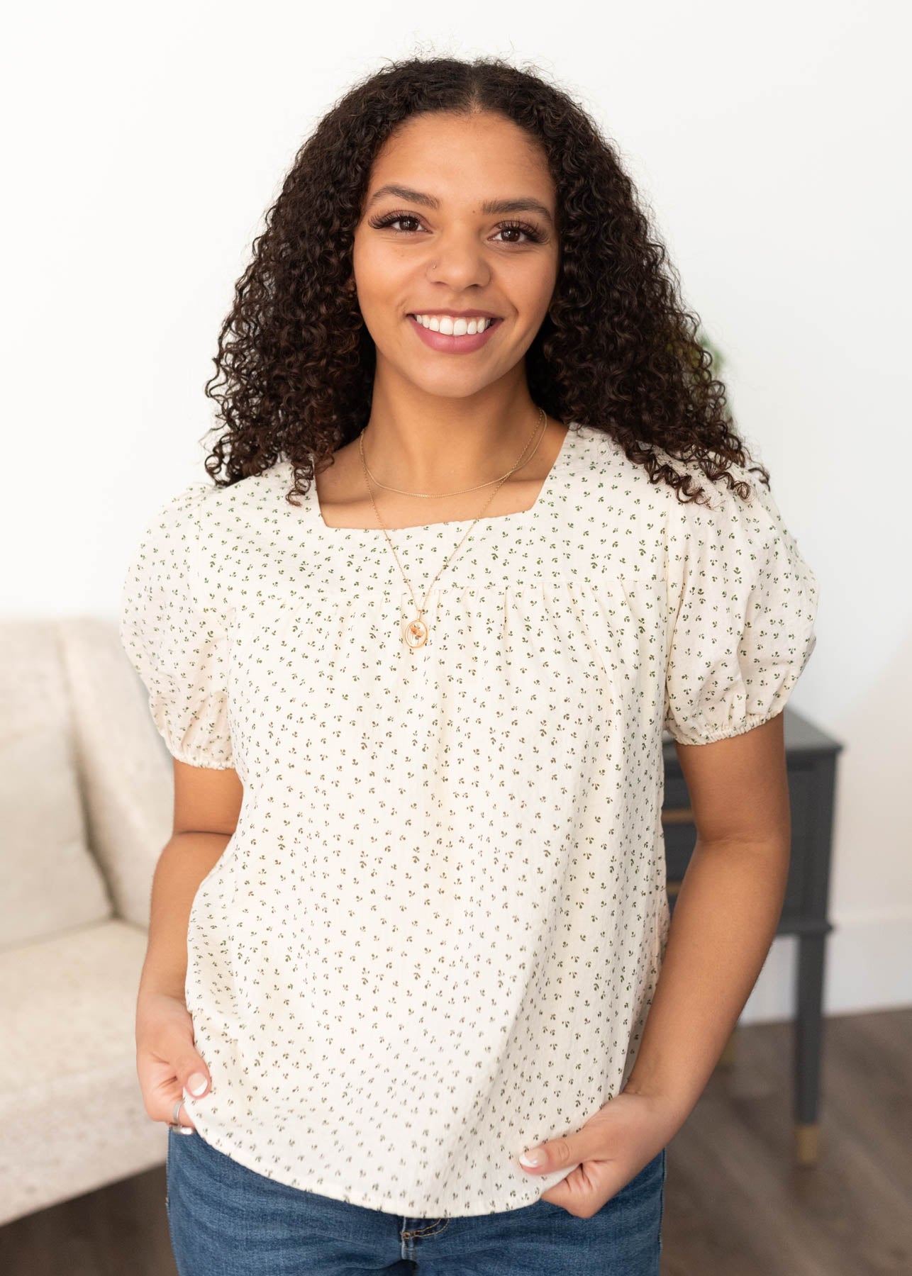 Front view of the cream floral print blouse