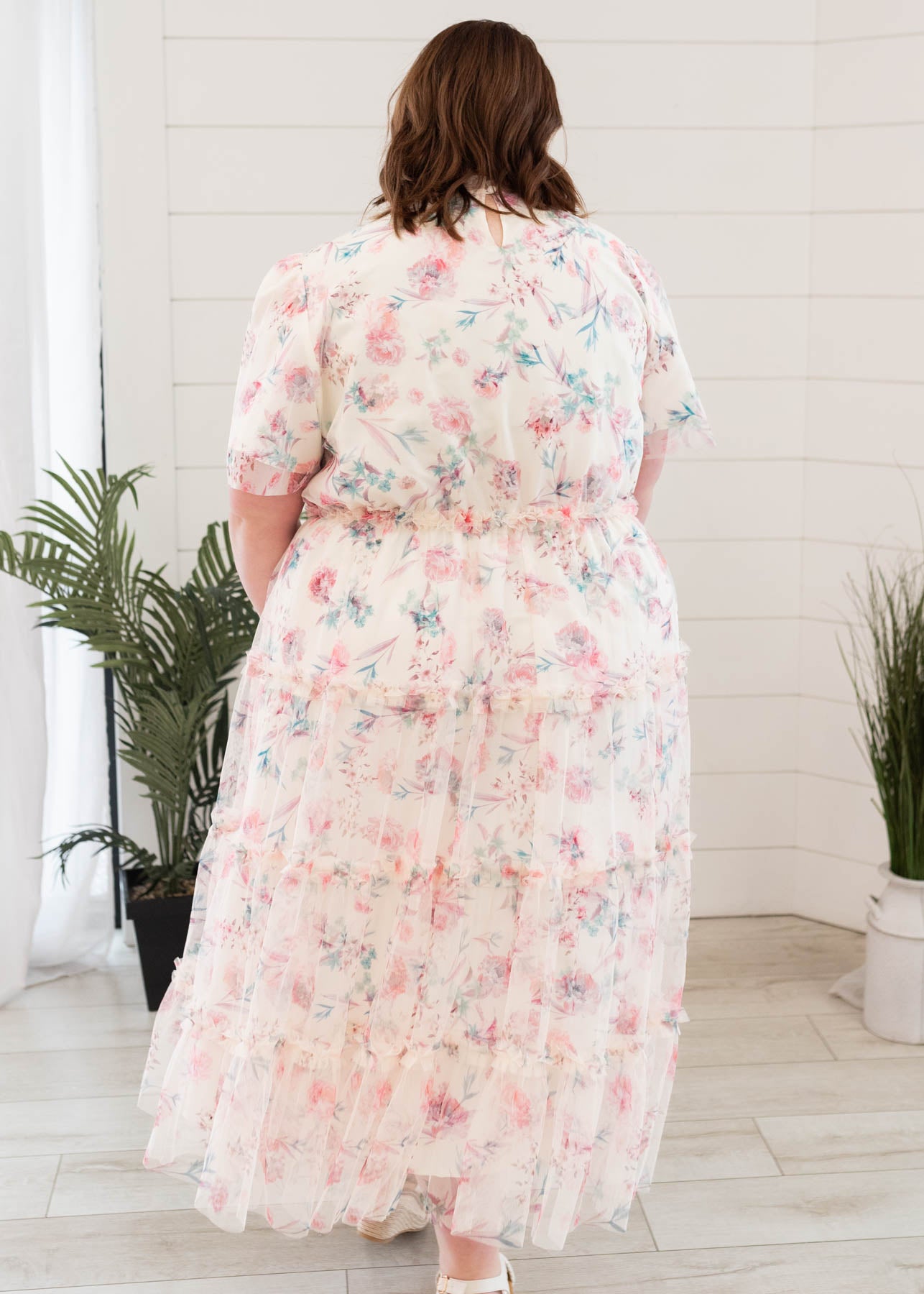 Back view of the pink floral mesh dress in plus size