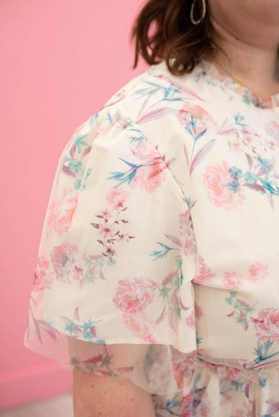 Close up of the sleeve and fabric on the pink floral mesh dress