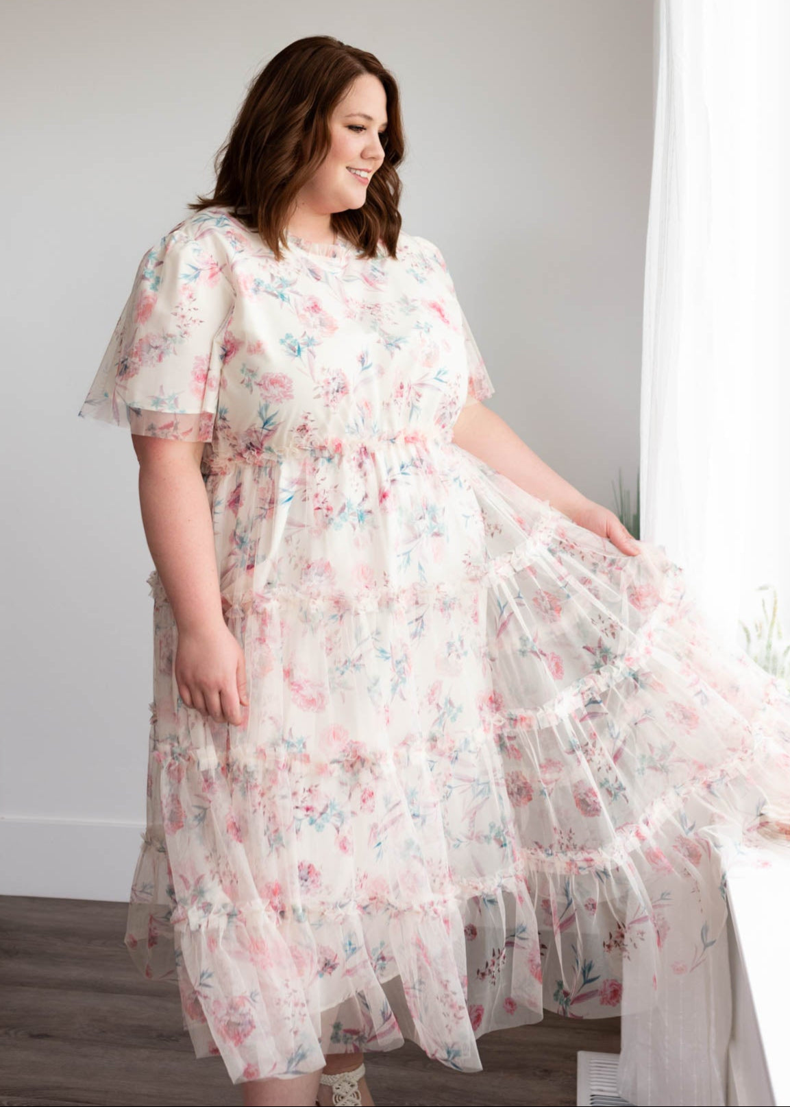 Tiered skirt on the plus size on the pink floral mesh dress