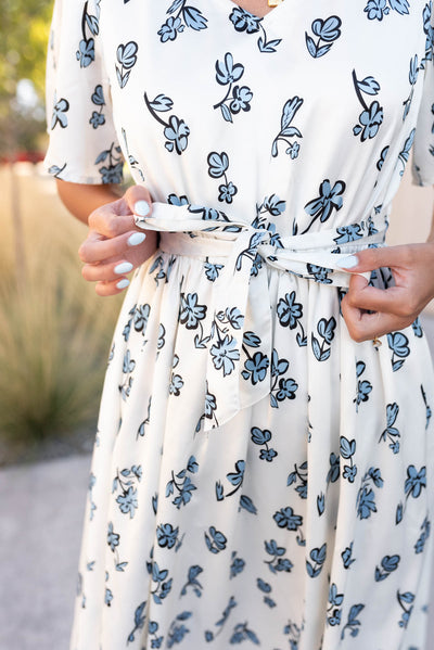 Close up of the tie at the waist on the blue floral dress