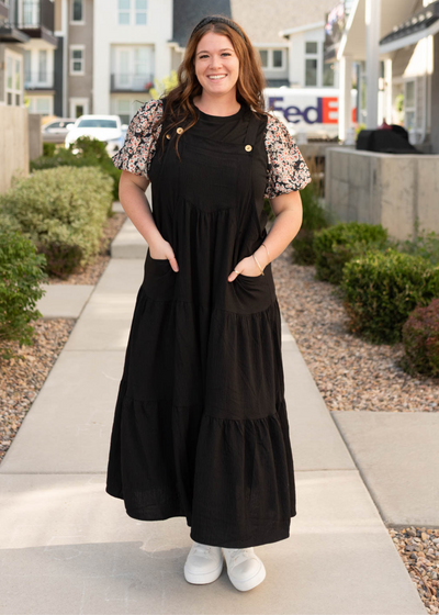 Plus size black overall dress with button strap