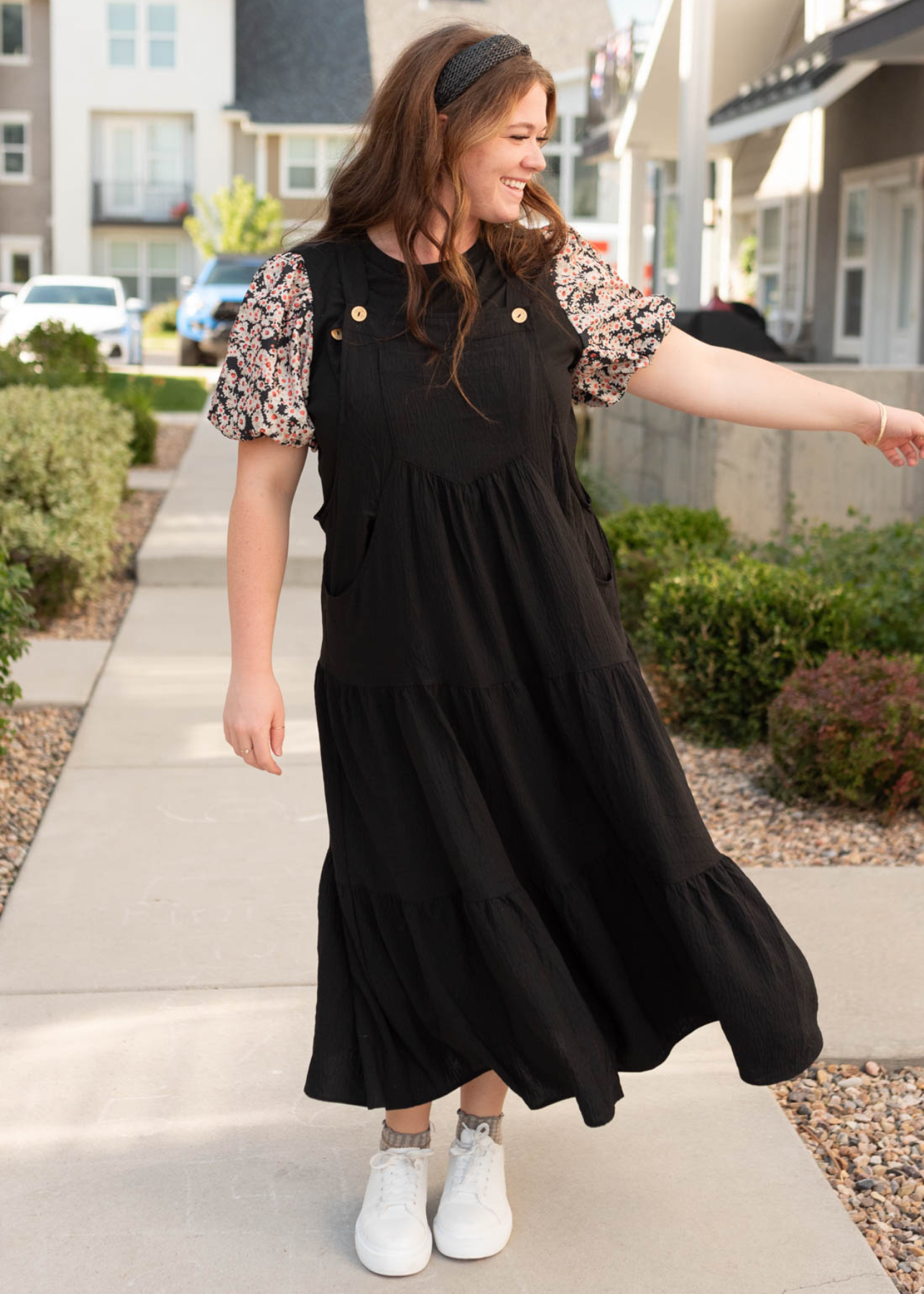 Plus size black overall dress with tiered skirt