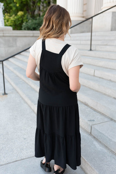 Back view of the black overall dress