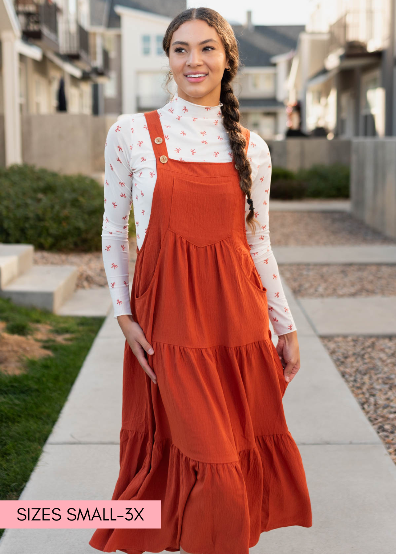 Rust overall dress with a tiered skirt